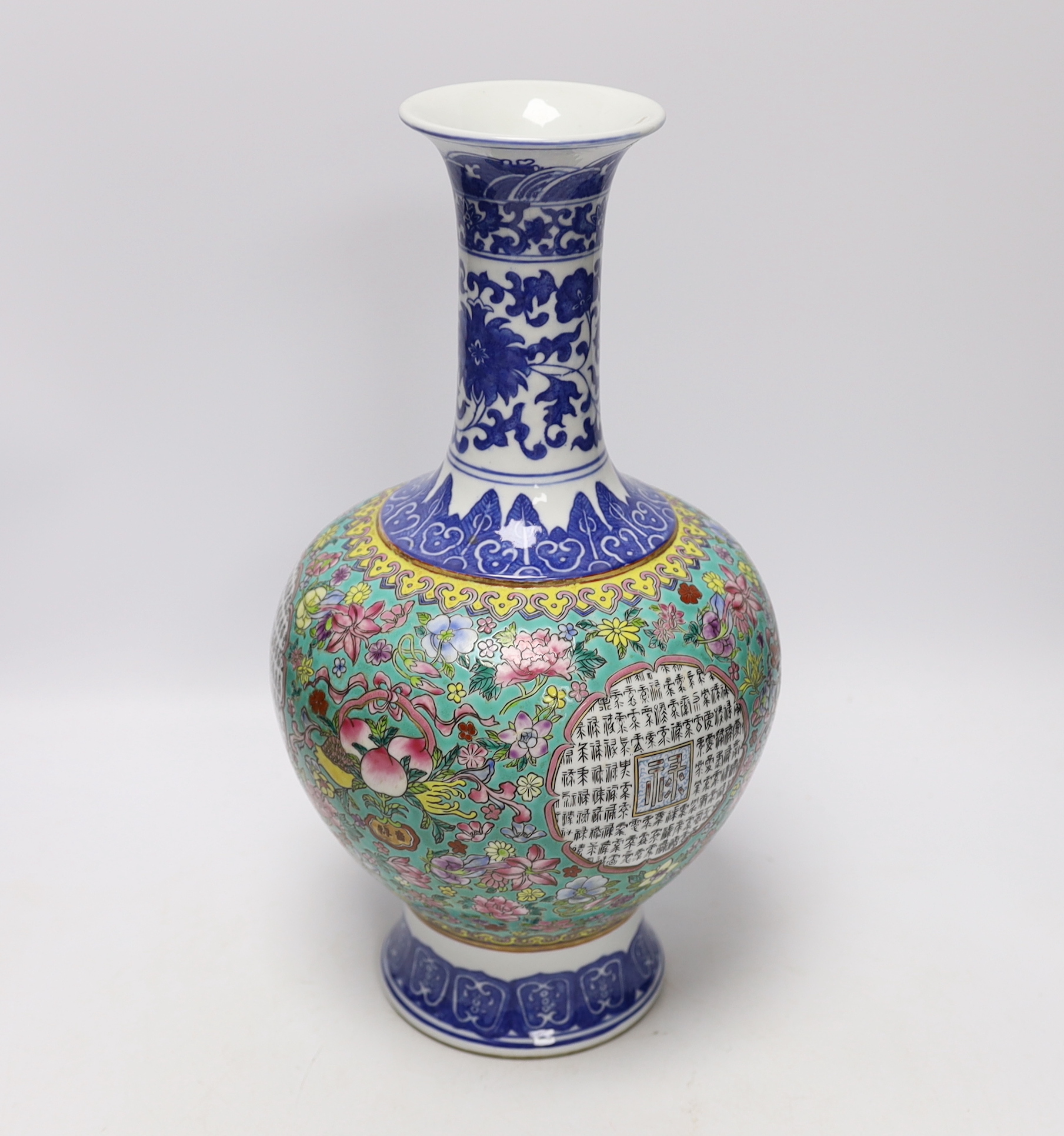 A Chinese famille rose vase, decorated with peaches and flowers, 35cm high